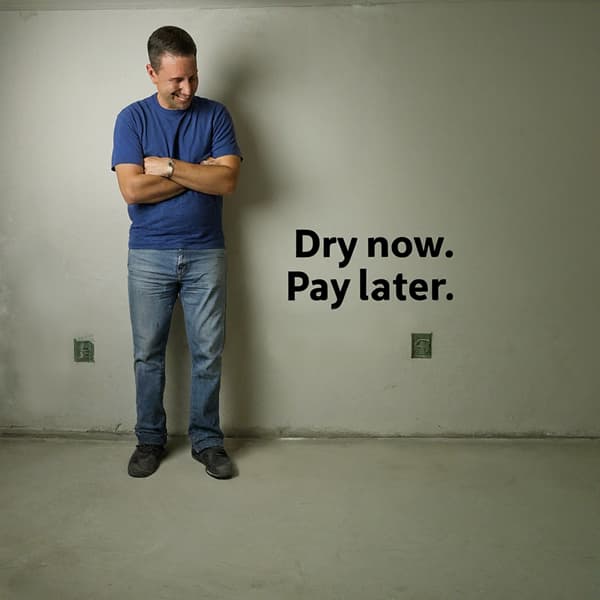 Man looking happy at dry basement floor