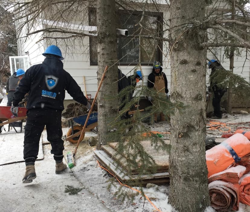 Image of a Shield Foundation Repair crew working in the snow.